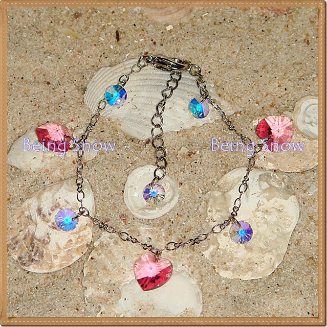 สร้อยข้อมือคริสตัลหัวใจ สีชมพู Rose สลับทรงกลมแบน สีใส