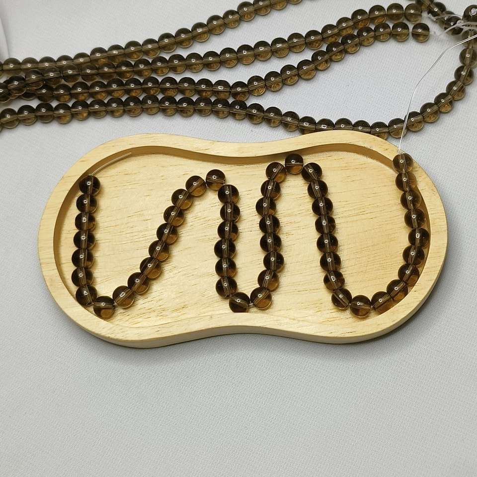 หินสโมกกี้ควอทซ์ หินจอมเวทย์ บรรลุเป้าหมาย ความสำเร็จ ลดเครียด ยาว 37 ซม. 8 มิล (50 เม็ด)