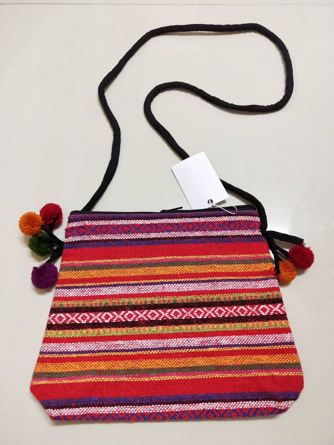 P420 กระเป๋าสะพายข้างสายยาวแต่งพู่กลมด้านข้าง พร้อมซิปบน โทนสีส้ม