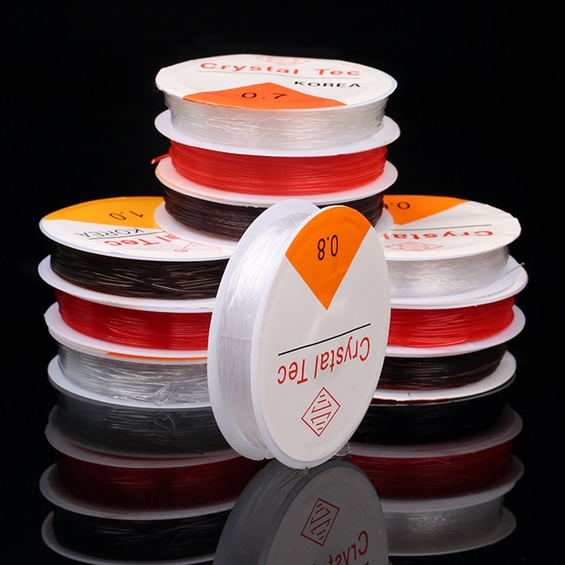 เอ็นยืดร้อยหิน เส้นกลม 0.6 มิล สีน้ำตาล ม้วนเล็ก 10 หลา แพคละ 300฿ (10 ม้วน)