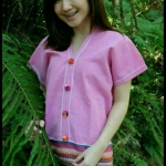 เสื้อนากา เสื้อผ้าพื้นเมือง เสื้อผ้าฝ้ายล้านนา สีชมพู แบบสวยน่ารัก คอวี แต่งกระดุม ลายผ้าพื้นเมืองสวยๆ