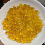 ลูกปัดแก้ว ทรงหยดน้ำ สีเหลืองขุ่น 10x15 มิล (1ขีด/100กรัม)